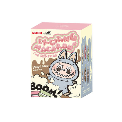 POP MART "Exciting Macaron" blind box featuring a grey, fanged, rabbit-eared monster, "BOOM!", and a macaron