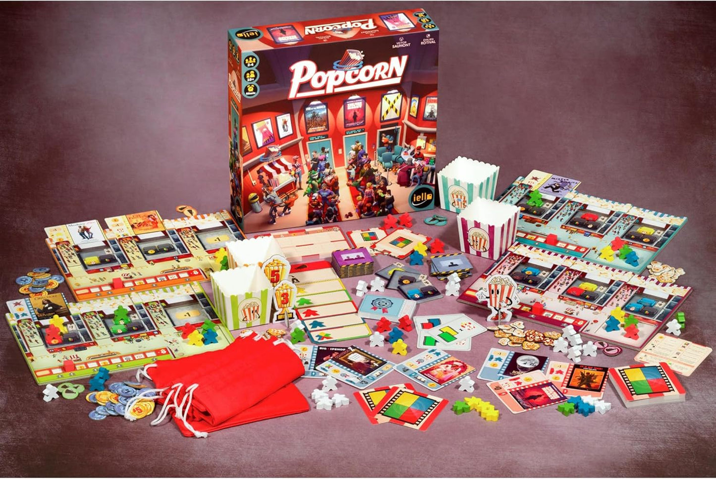 The board game "Popcorn" with its box and components laid out. Includes cinema lobby art, boards, cards, tokens, and mini popcorn boxes