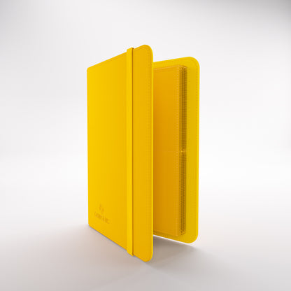 Gamegenic prime album open to textured pages for trading cards, with an elastic closure strap