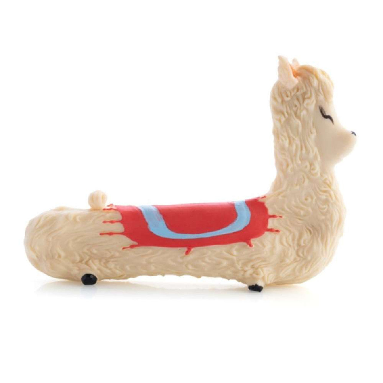 Cream-colored llama figurine toy with a long body and a red and blue saddle blanket
