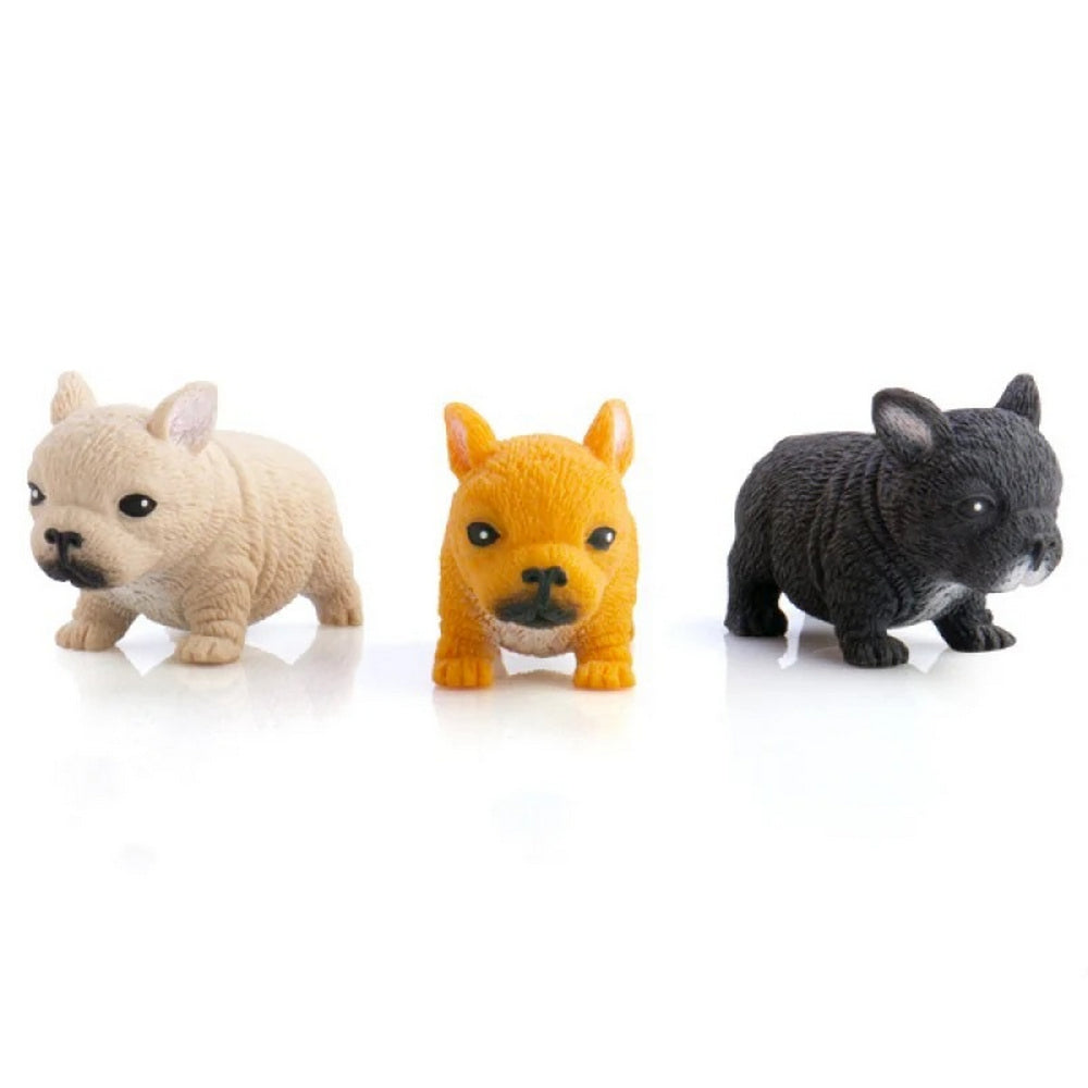 Three French Bulldog puppy figurines: tan, orange, and black, on a white background