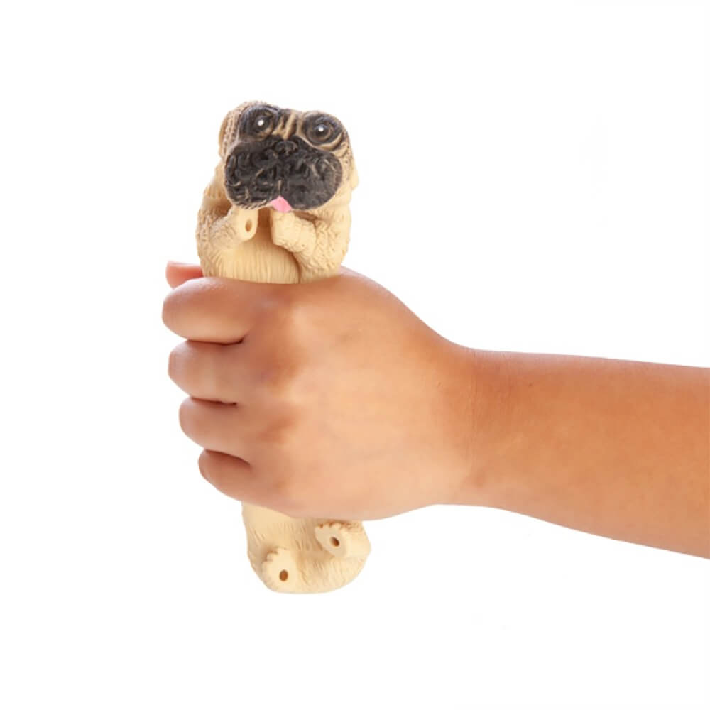 Hand squeezing a beige pug stress toy with black snout and pink tongue