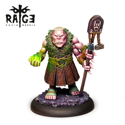 A painted Fantasia Latorre Resins Celberum Dark Rune Figure 35mm, a muscular man with green glowing hand, holding a staff, wearing leaf armor and a patterned kilt