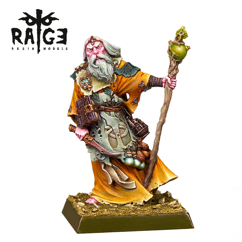 Painted miniature of an old wizard with a white beard and orange robes, holding a green-orbed staff and a dagger