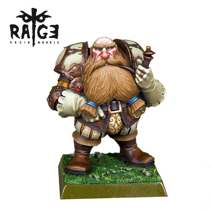 A miniature Yugen Bad Pipe Figure depicts a grumpy, bearded dwarf in ornate armor holding a pipe, standing on a grassy base