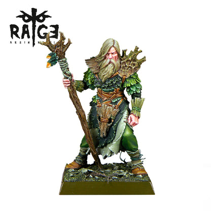 Painted fantasy miniature of a bearded druid in green leaf armor, holding a gnarled wooden staff