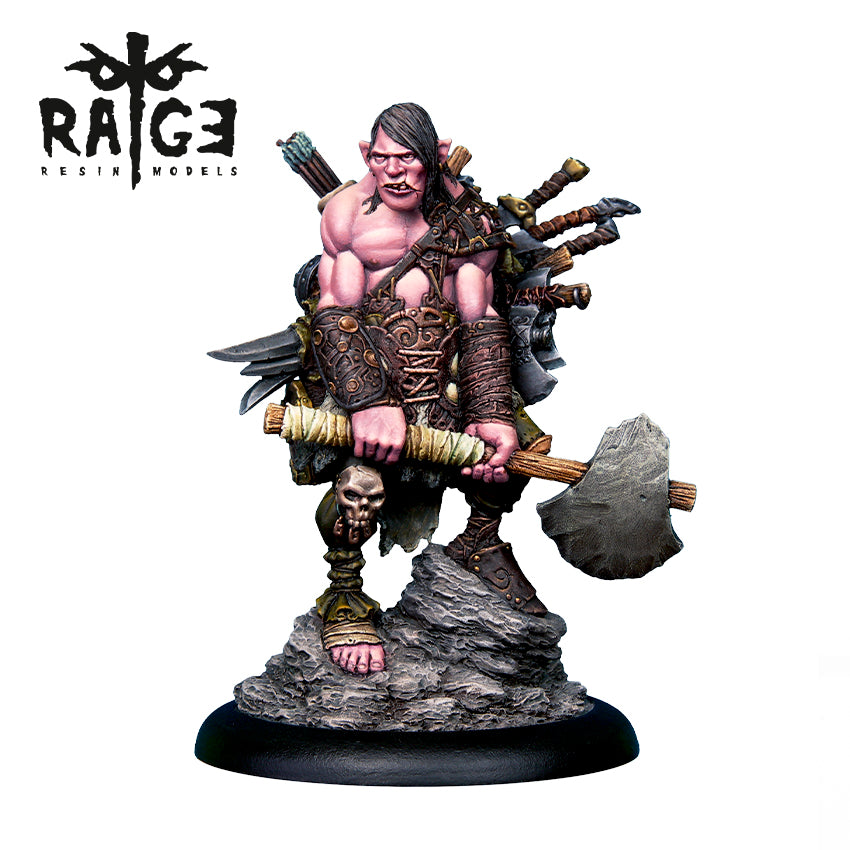 A painted Battle Gnome Figure wielding a large axe, with various weapons strapped to its back, standing on a rocky display base