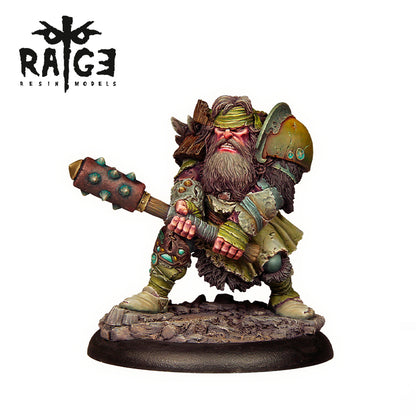 A painted miniature of the Brom Hard Bark figure, a bearded warrior in armor holding a spiked club, standing on a rocky base