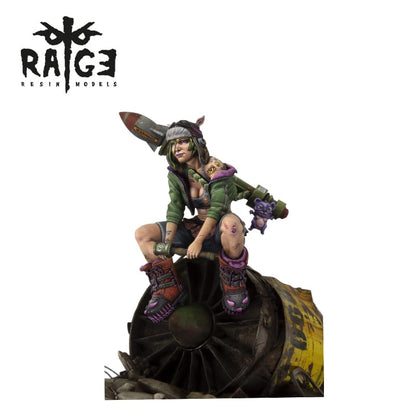 A resin model of a grungy woman with green hair, holding a rocket-spear and a small creature, sitting on a rusted turbine