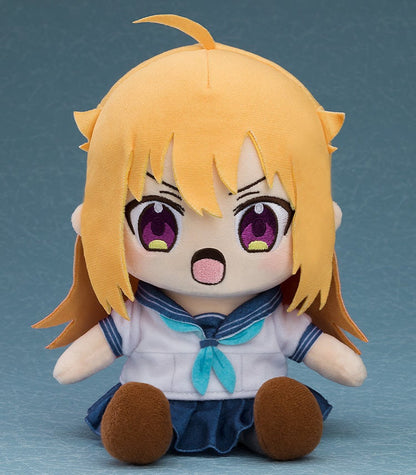 Orange-haired anime girl plush with wide purple eyes and an open mouth, wearing a white sailor uniform and blue skirt, sitting