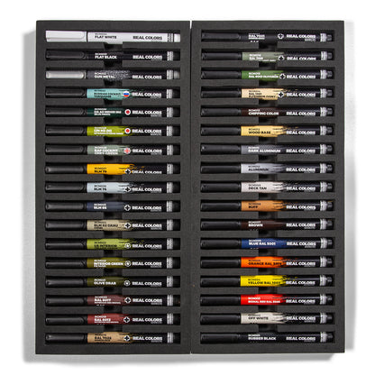 An open black box displays 34 Real Colors Markers in various shades, neatly organized in two columns within foam slots