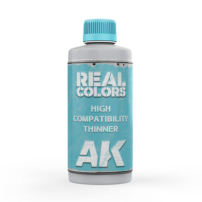 Grey bottle of AK Real Colors High Compatibility Thinner, with a blue cap and distressed blue label.