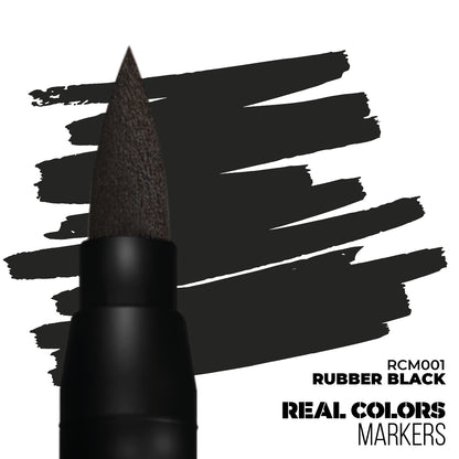 Black brush marker and 'Rubber Black' ink swatches on white