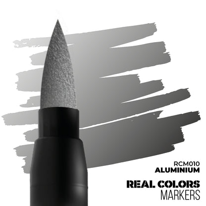 A Real Colors marker with an aluminium brush tip creating metallic grey strokes. Text: RCM010 ALUMINIUM