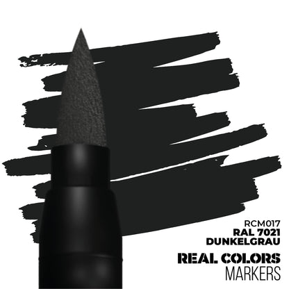 A dark gray Real Colors marker pen with a brush tip makes dark gray strokes. Labeled RAL 7021 Dunkelgrau