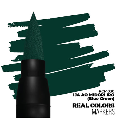 A dark blue-green marker's brush tip next to swatches of its deep blue-green ink