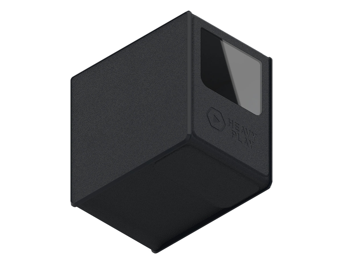Dark gray textured rectangular device shown at an angle, with a black screen and &#39;HEAVY PLAY&#39; logo on its side.