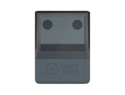 Its upper half features two circular dark shapes, and its lower half has a 'HEAVY PLAY' logo and play button