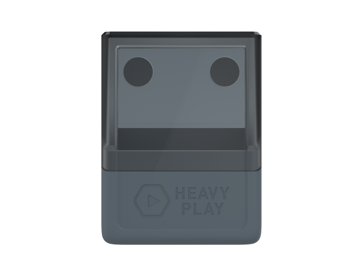A two-tone grey Heavy Play deckbox with two dark circles on the top section and embossed Heavy Play text on the front