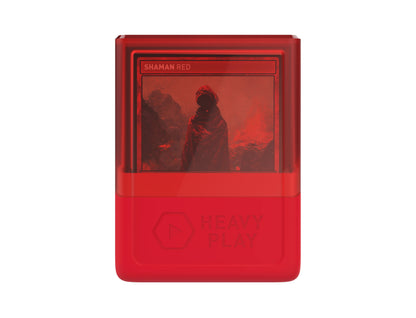 Red digital collectible with "SHAMAN RED" title, depicting a cloaked figure in a fiery red landscape, branded "HEAVY PLAY"