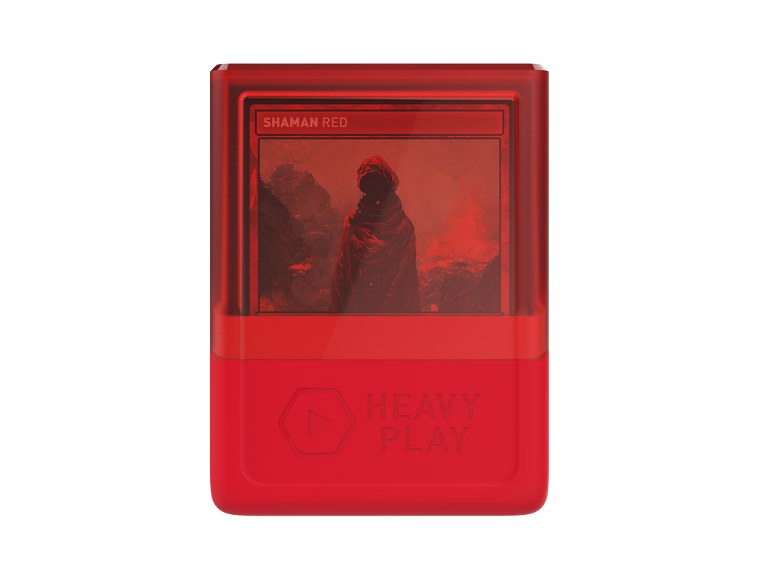 Red digital media player displaying &quot;SHAMAN RED&quot; with a red-toned image of a robed figure. &quot;Heavy Play&quot; branding below
