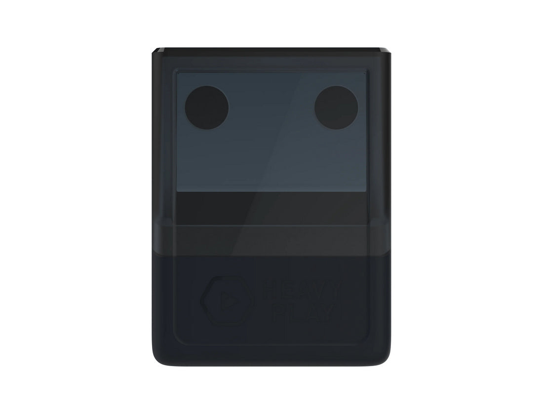 A modern dark gray pencil sharpener with two holes on top, a translucent shaving bin, and a &quot;HEAVY PLAY&quot; logo