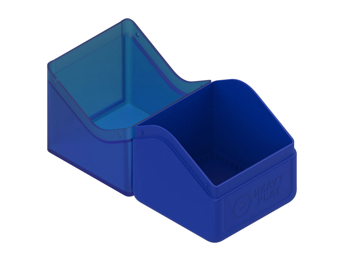 Open blue card deck box: transparent lid tilted back, revealing opaque base with &#39;HEAVY PLAY&#39; text