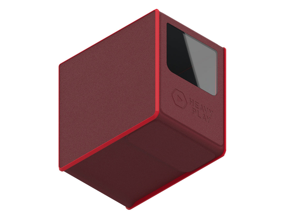 A dark red textured deck box with bright red trim, a dark window, and "HEAVY PLAY" text on its side