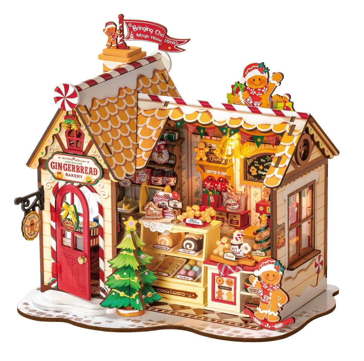 Detailed, illuminated Christmas miniature model of a "Gingerbread Bakery" shop filled with tiny pastries