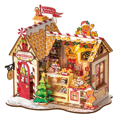 Detailed, illuminated Christmas miniature model of a "Gingerbread Bakery" shop filled with tiny pastries