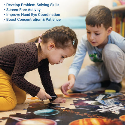 Two children kneeling on the floor, collaborating on a large space-themed jigsaw puzzle
