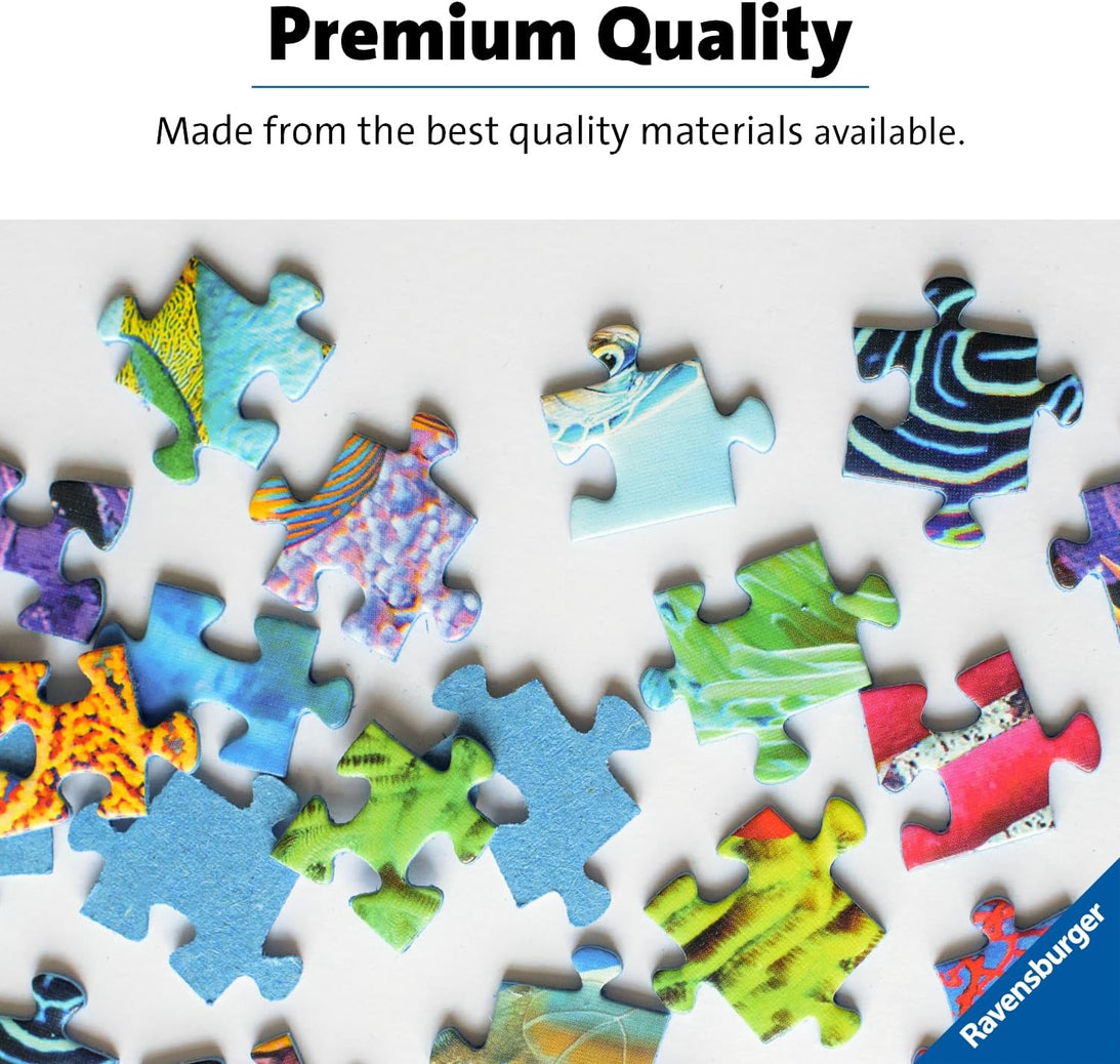 Scattered colorful, patterned Ravensburger jigsaw puzzle pieces on a white background, with "Premium Quality" text