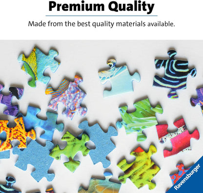Scattered colorful, patterned Ravensburger jigsaw puzzle pieces on a white background, with "Premium Quality" text