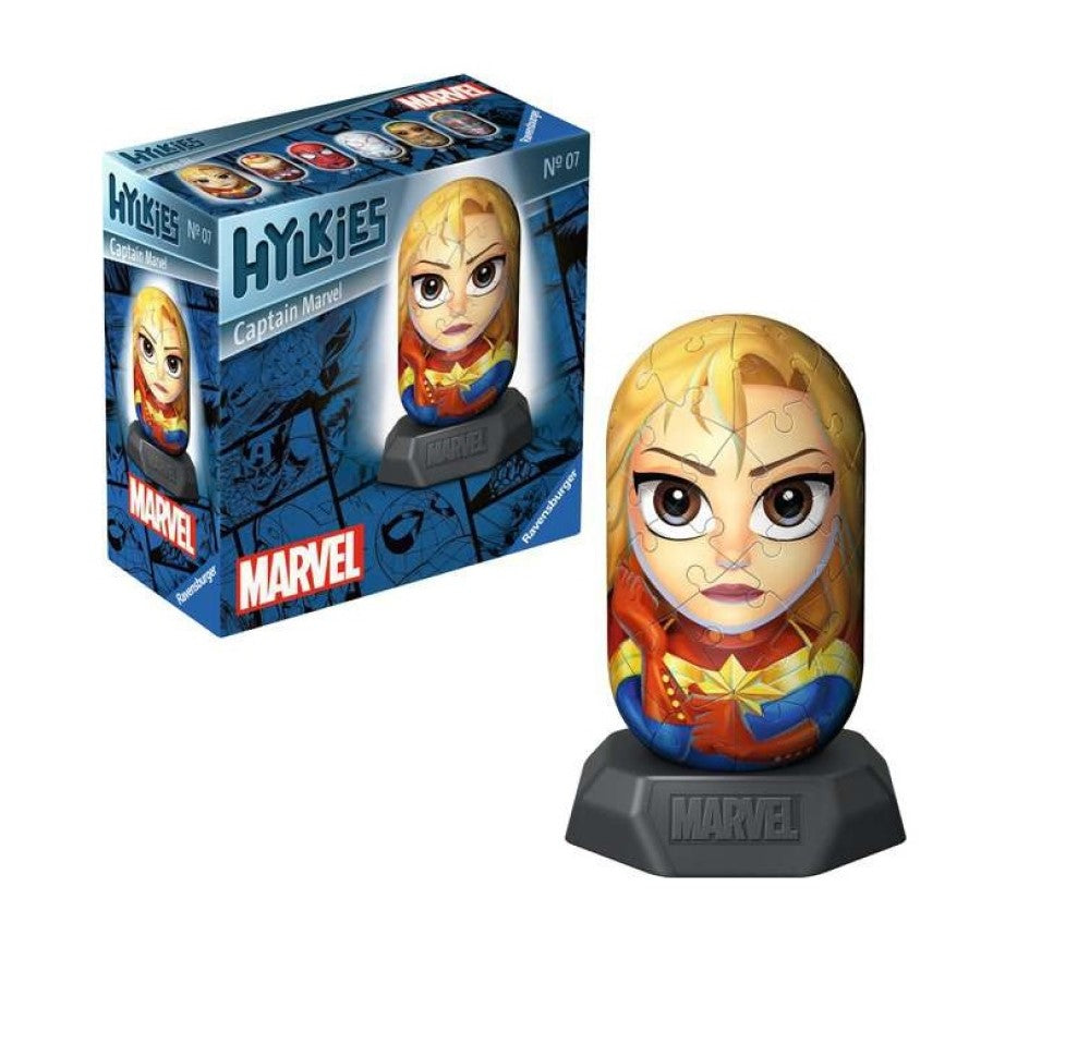 Assembled 3D puzzle of Captain Marvel in her red, blue, and gold suit on a stand. Its blue box is visible behind