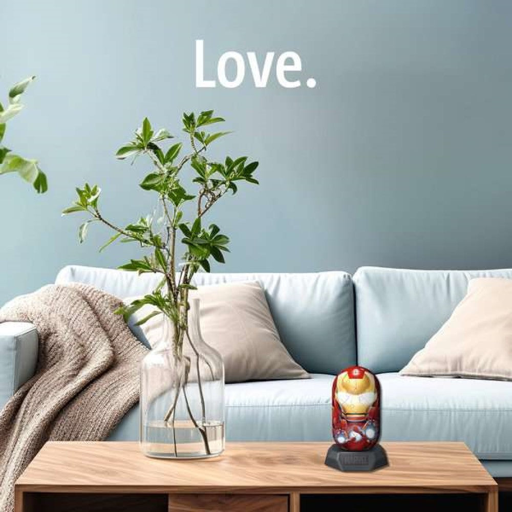 Iron Man-themed item on a wooden coffee table in a living room with a plant, sofa, and 'Love.' on the wall
