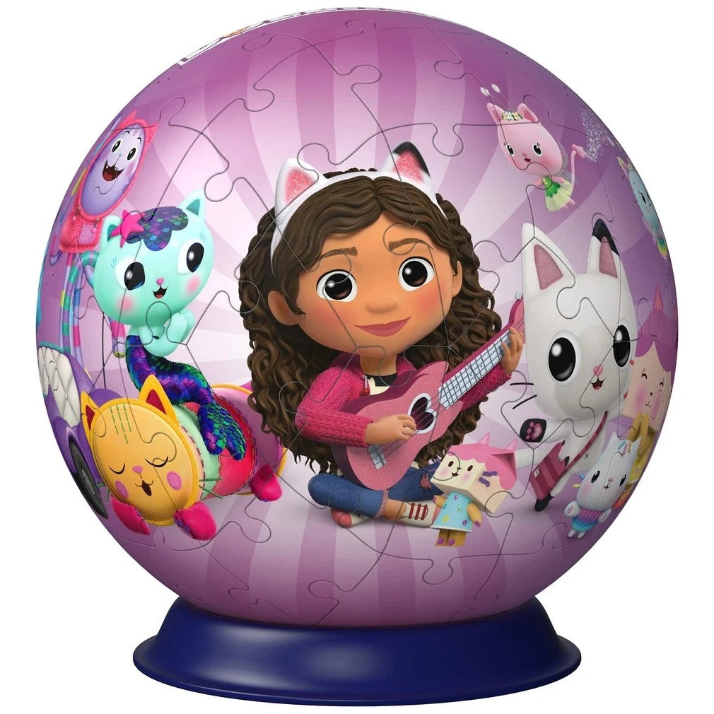 Gabby's Dollhouse spherical puzzle shows Gabby playing a pink guitar, surrounded by her diverse cat-like friends
