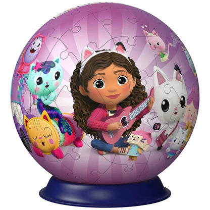 Gabby's Dollhouse spherical puzzle shows Gabby playing a pink guitar, surrounded by her diverse cat-like friends