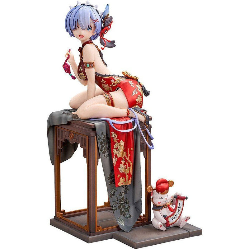 Anime figure in red cheongsam, kneeling on a table next to a lucky cat