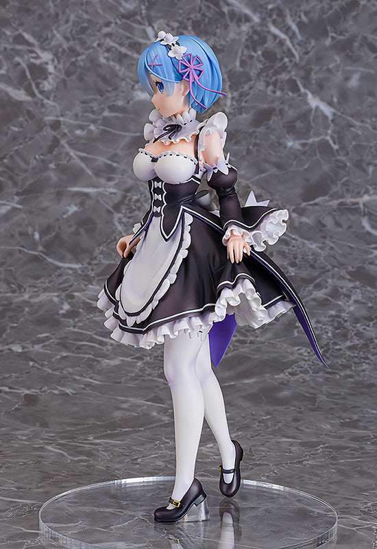 Rem anime figure in maid outfit standing on clear display base