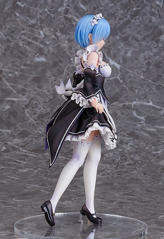 Rem maid outfit anime figure with short blue hair and white leg warmers