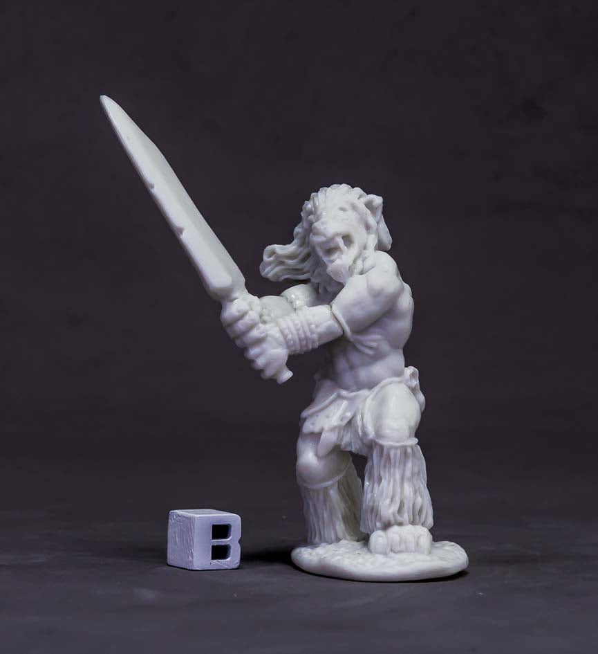 An unpainted lion-headed miniature brandishes a sword. A small gray 'B' cube sits nearby