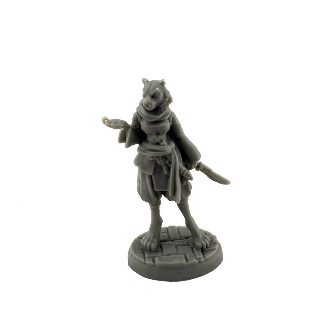 Unpainted grey miniature depicting a feline warrior with a dagger, one hand open, on a stone base