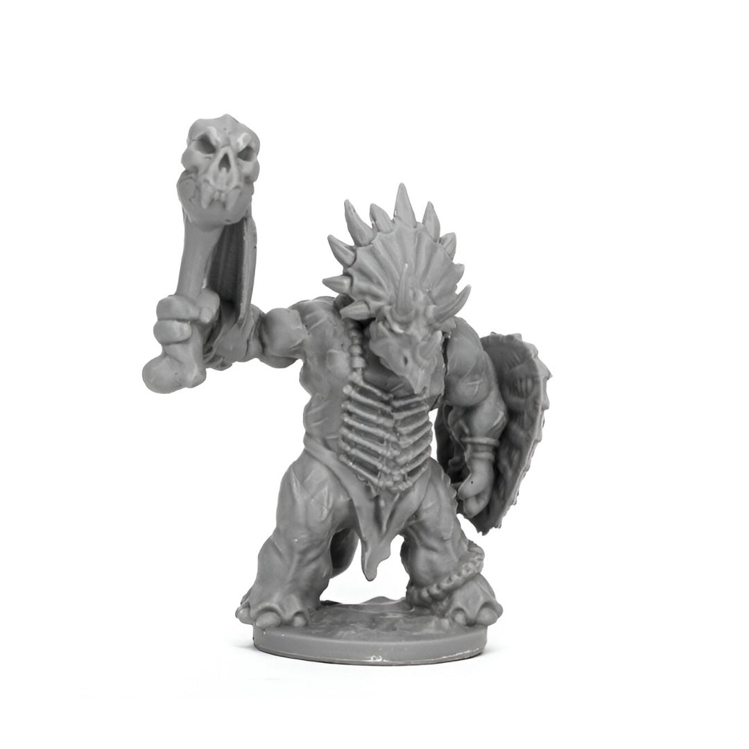 Unpainted grey fantasy miniature of a horned dinosaur warrior wielding a skull club and shield