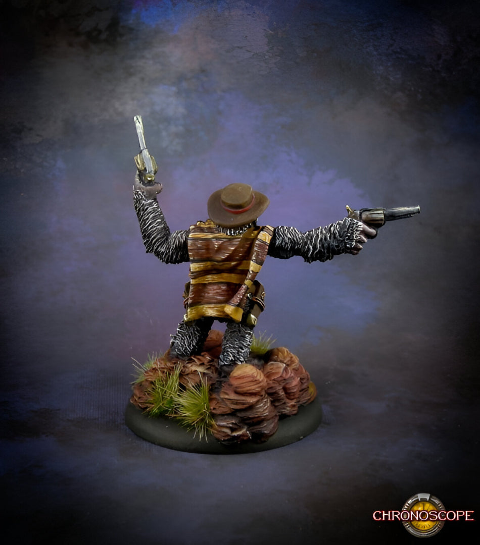 A detailed miniature of a gorilla-like gunslinger wearing a cowboy hat and striped poncho, dual-wielding two revolvers