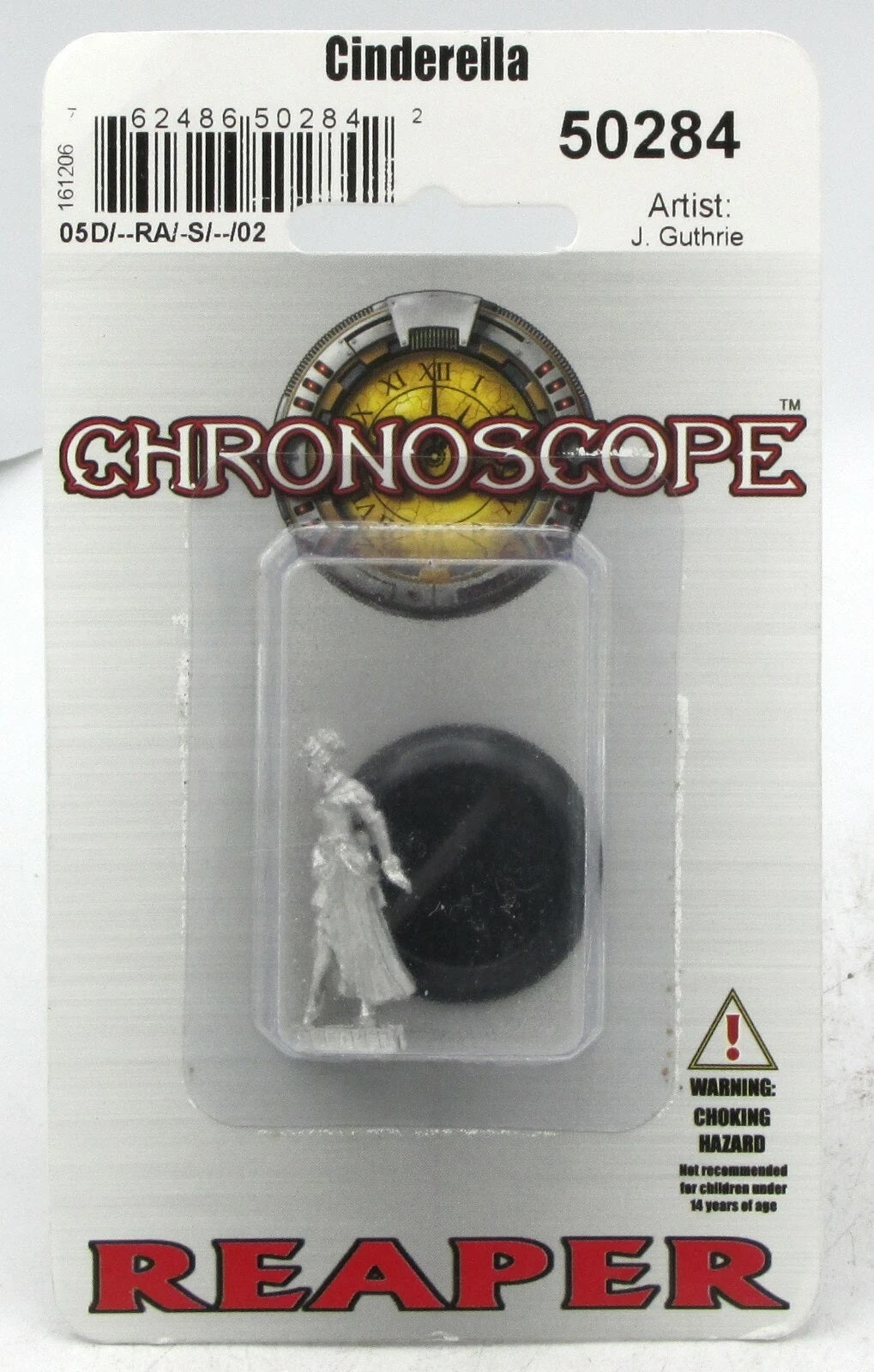 Reaper Chronoscope Cinderella miniature in blister pack. Unpainted metal female figure in a dress, with a black base