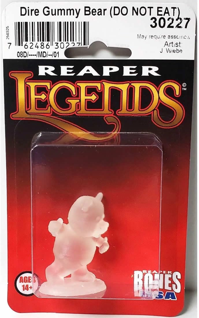 Packaged translucent Dire Gummy Bear miniature figure, poised to move. Label warns 'DO NOT EAT', by Reaper Legends