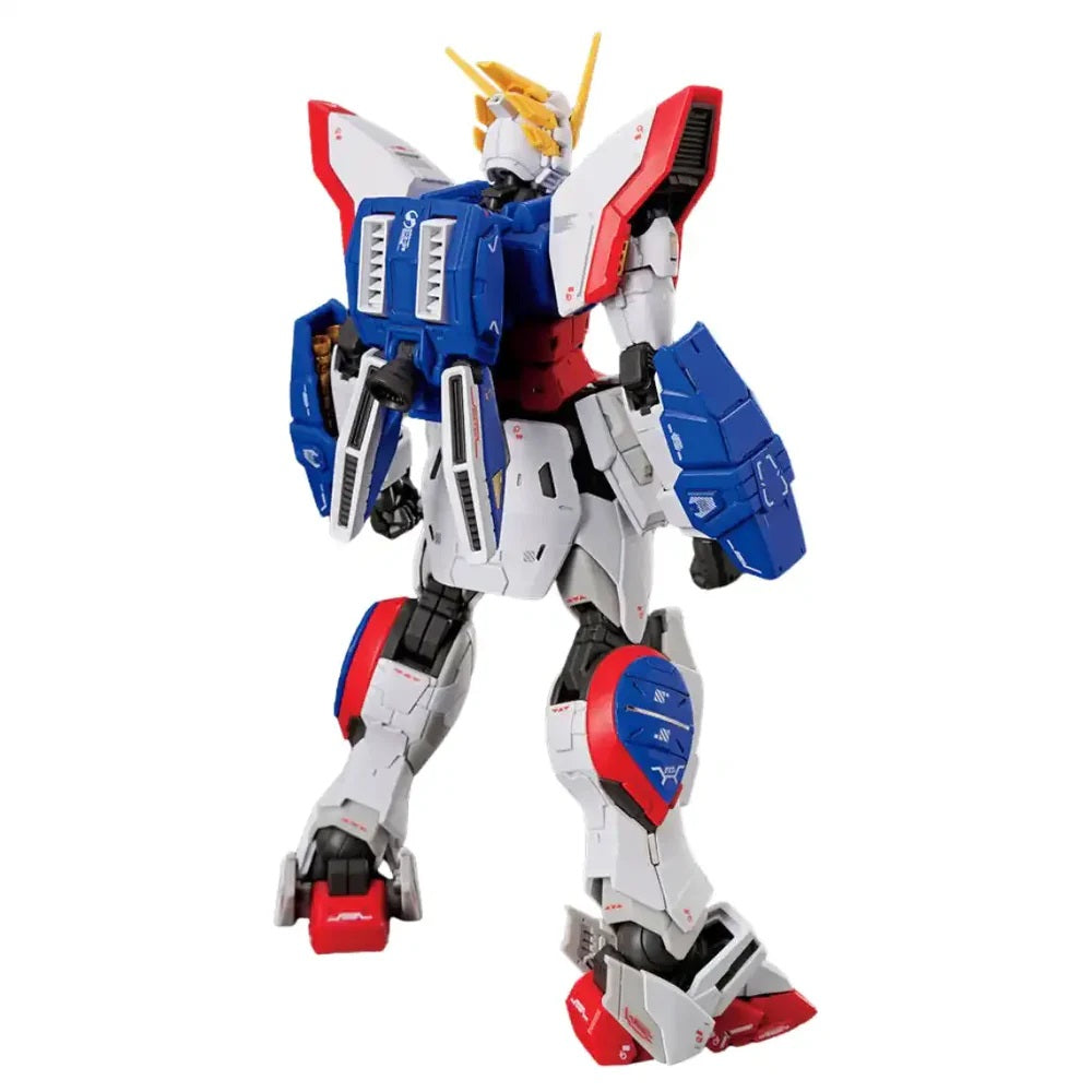 White, blue, red Gundam model with intricate armor and yellow V-fin, standing