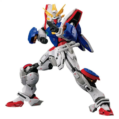 White, blue, and red God Gundam model kit in a dynamic martial arts pose, ready to strike