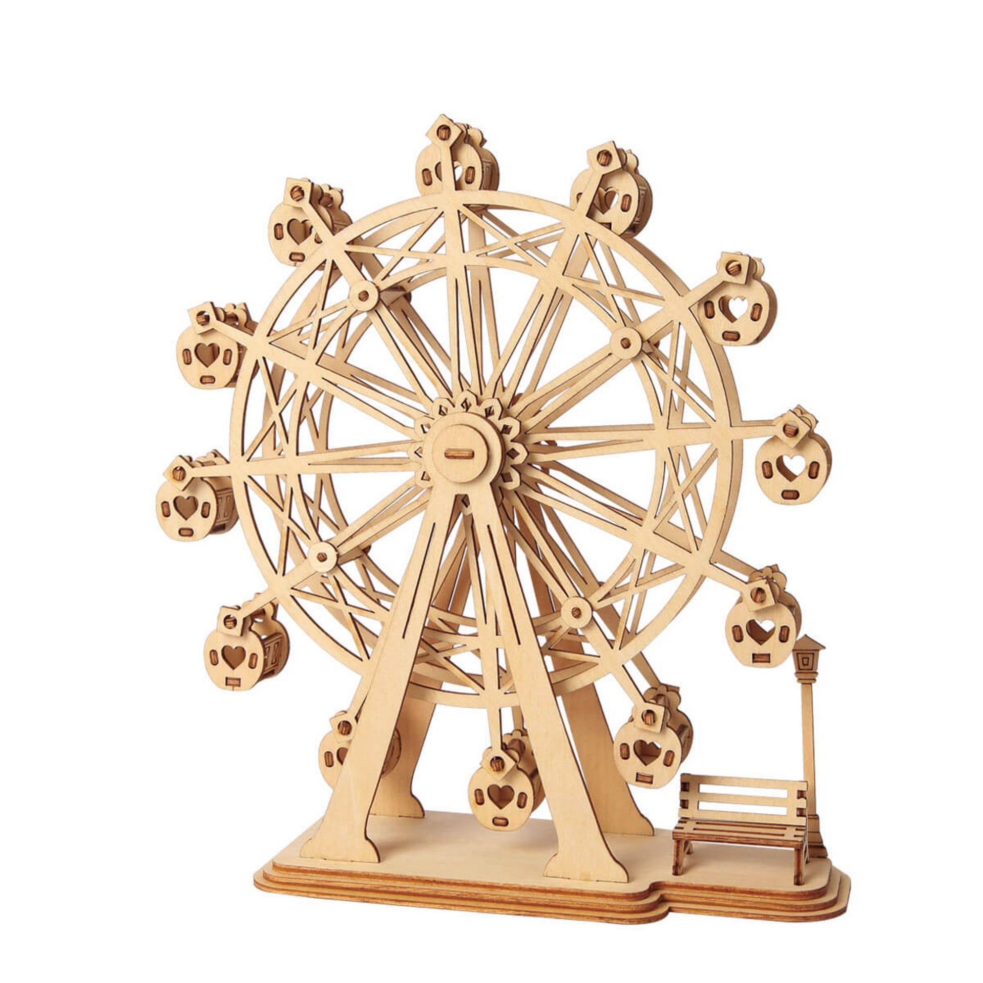 Wooden 3D puzzle model of a Ferris wheel featuring heart-shaped gondolas, a park bench and lamp