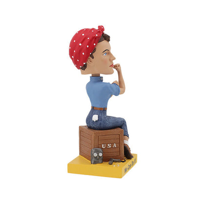 Rosie the Riveter Royal Bobbles bobblehead with red bandana and blue shirt sitting on a crate side view